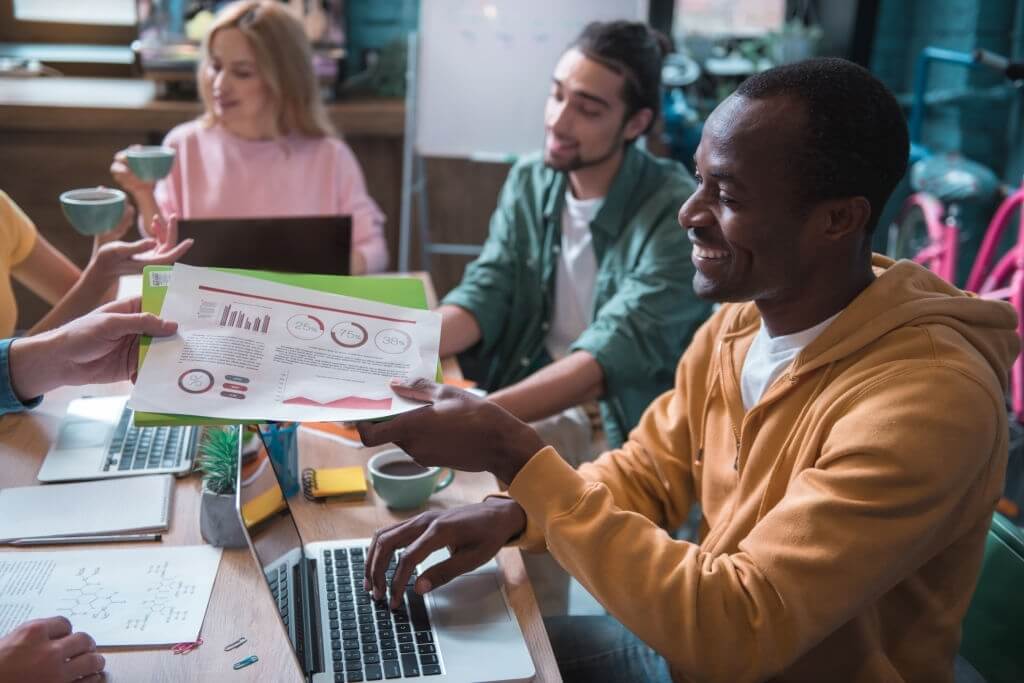 People in an office analyzing different results